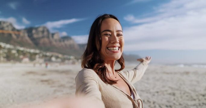 woman taking a selfie pov facing camera on beach All-Inclusive Solo Vacation Packages