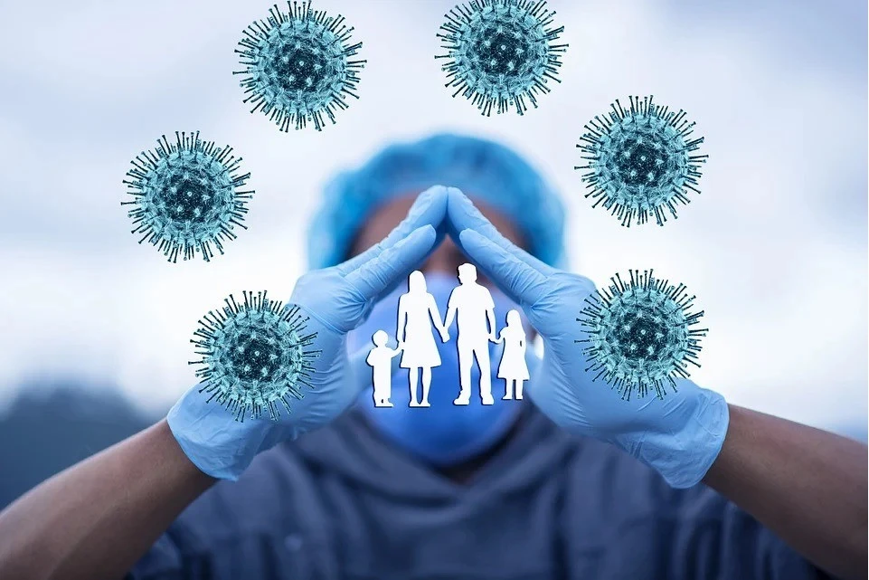 picture of medical worker hollding hands around a family and geram cells all around