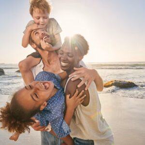 family-playing-on-beach