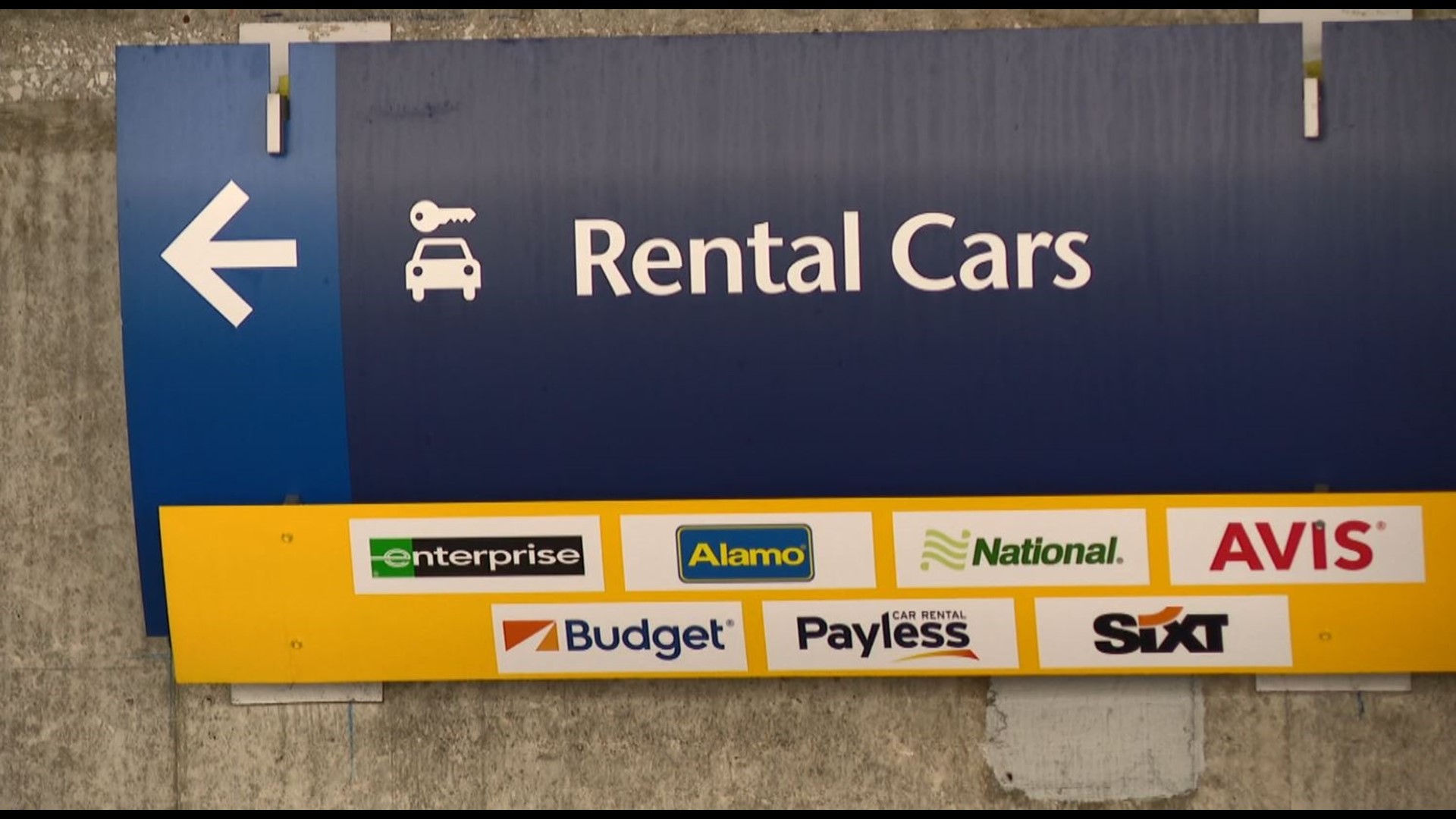 picture of a rental car sign at the airport