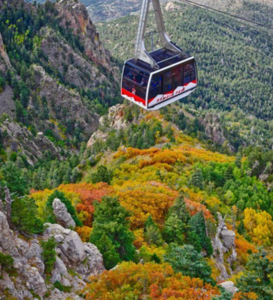 albuquerque nm fall colors looking down over valley at a gondala in the air