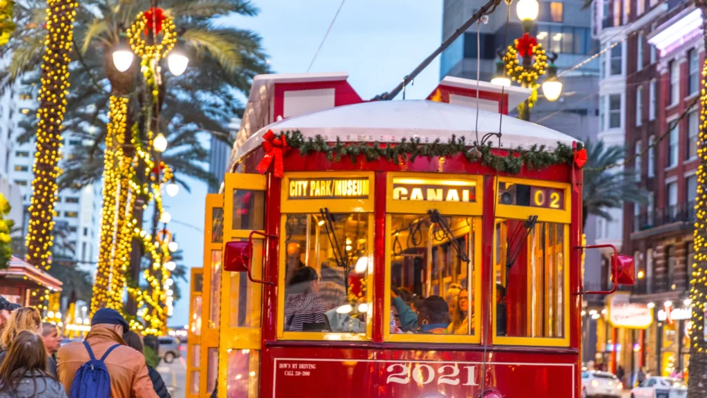 new orleans christmas time picture of trolley decorated for christmas and palm trees as well