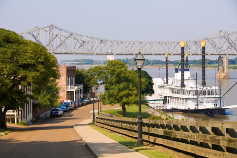 Natchez Mississippi looking over the river with a paddle boat and waterfront in foreground