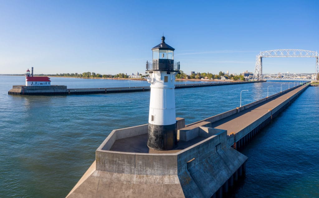 aerial-panorama-photo-of-the-beautiful-north-pier-lighthouse-in-duluth-minnesota-in-the-background