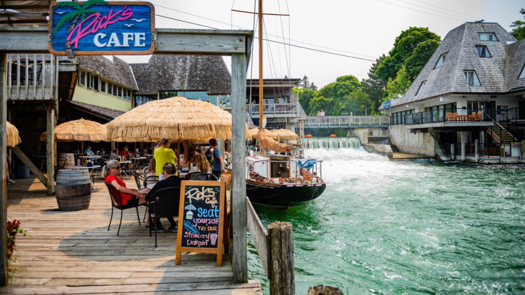 traverse city watrfront dining michigan a great budget friendly weekend man and sitting by the water a boat by the waterfall